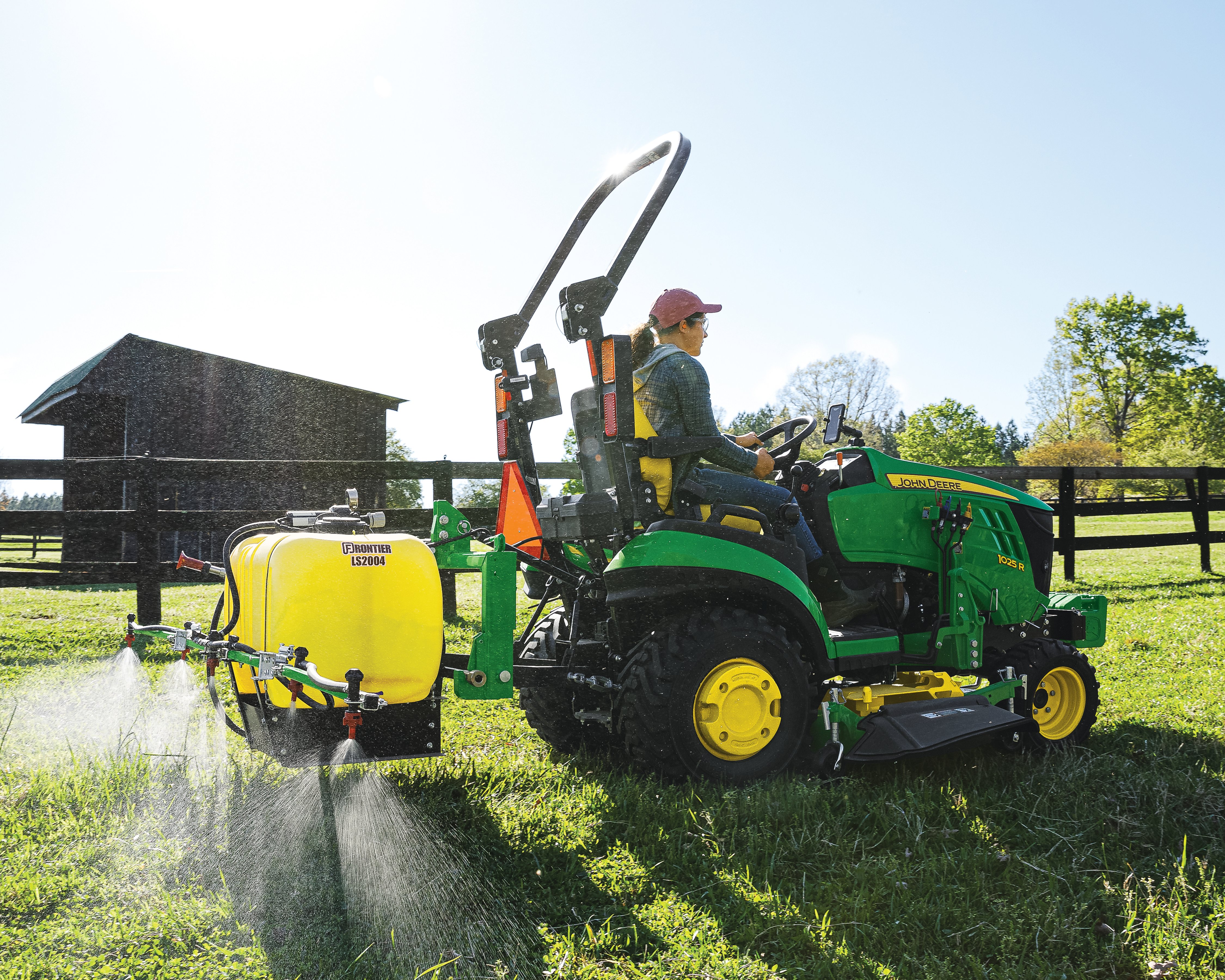 Mounted Sprayer being used with a 1025 John Deere compact utility tractor