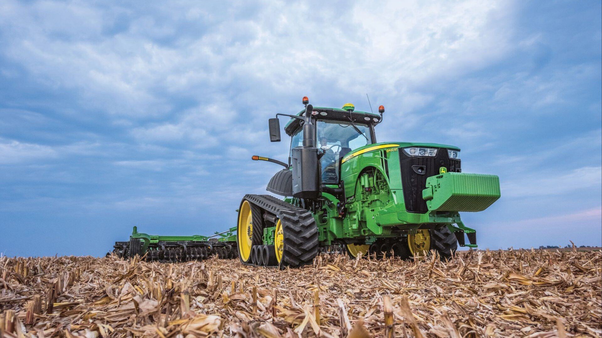 8R with tracks pulling tillage