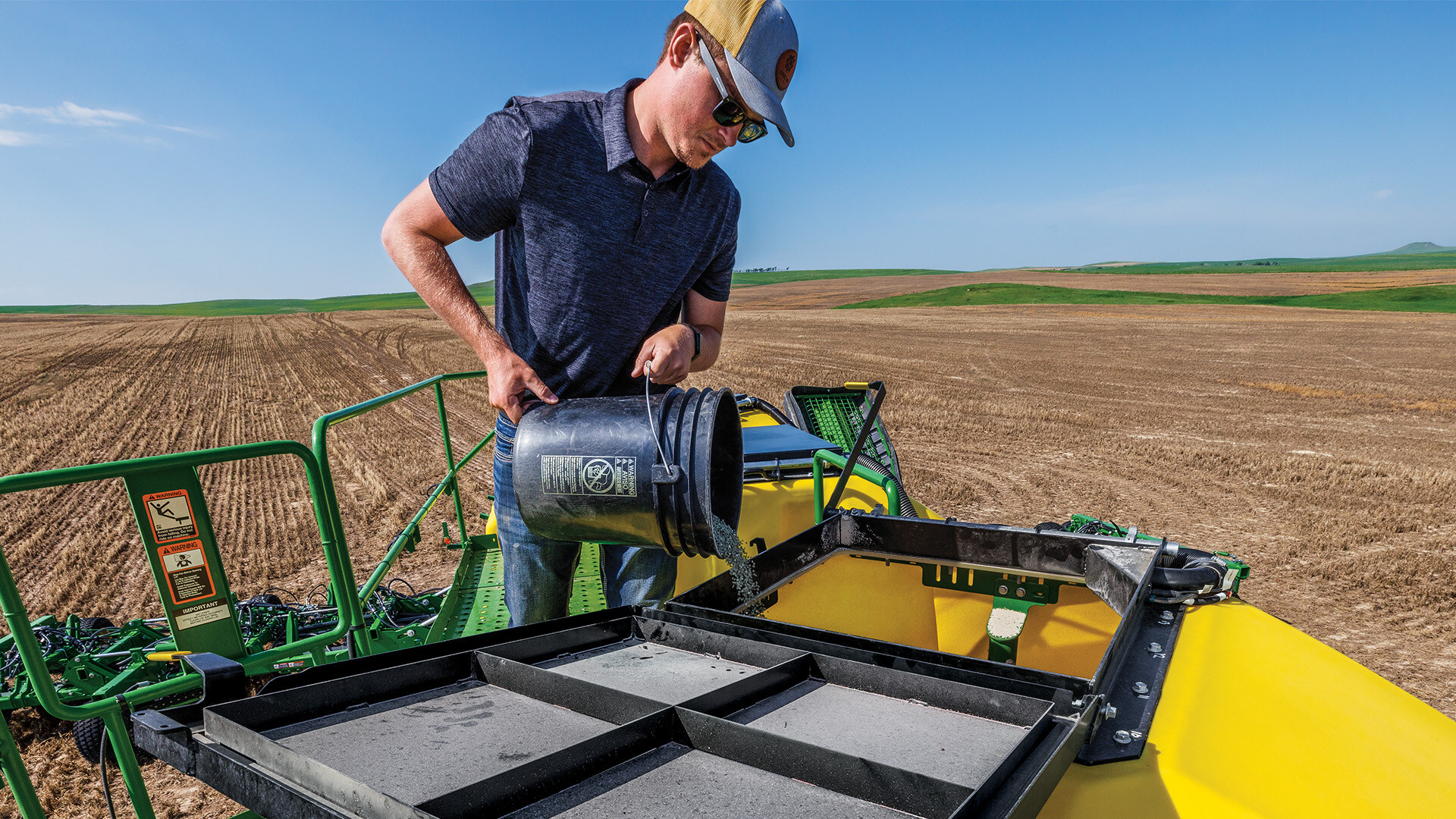 Filling John Deere Air Seeder