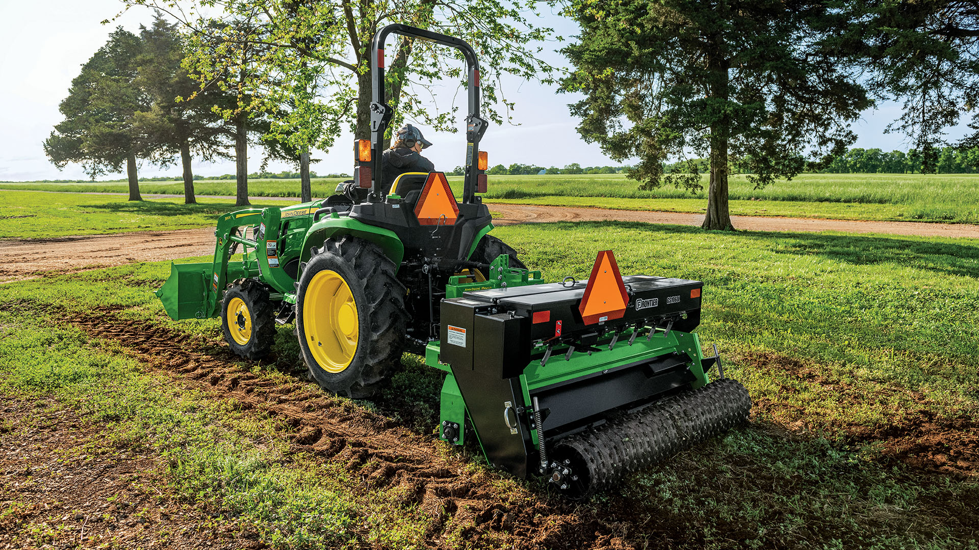 John Deere 3025E with Attachments