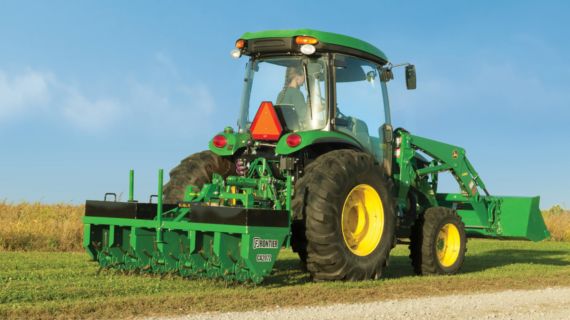 John Deere Tractor with Aerator Attachment