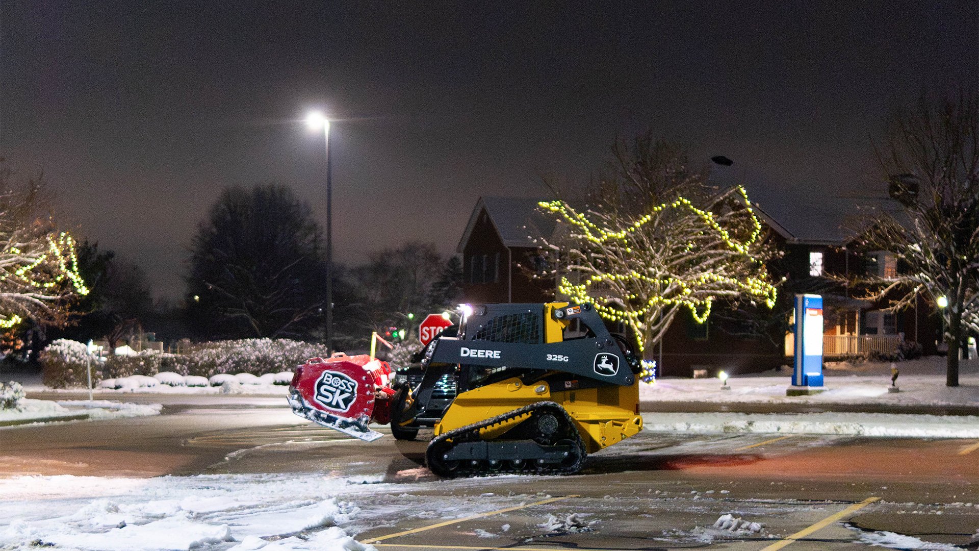 John-Deere-Skid-Steer-for-plowing-snow-Koenig-Equipment