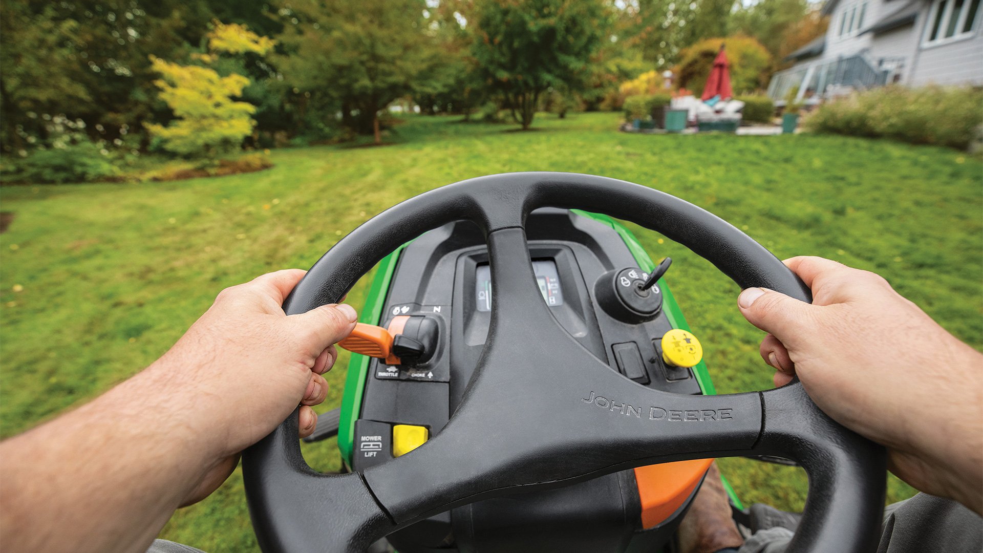 John-Deere-lawn-mower-with-a-steering-wheel