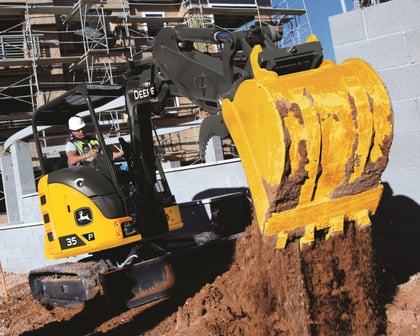 A John Deere 35P compact excavator on a job site.