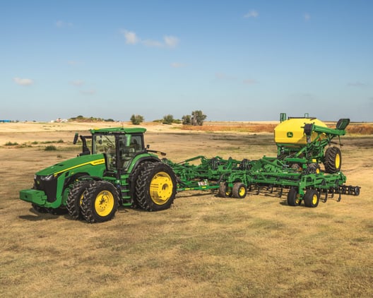 A John Deere 8R 410 in a field in the Midwest.