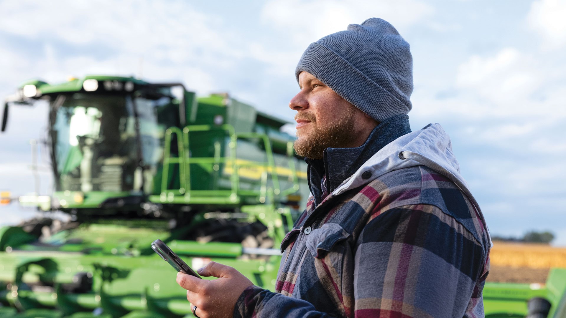 Combine-Man-With-Phone-Winter-Hat
