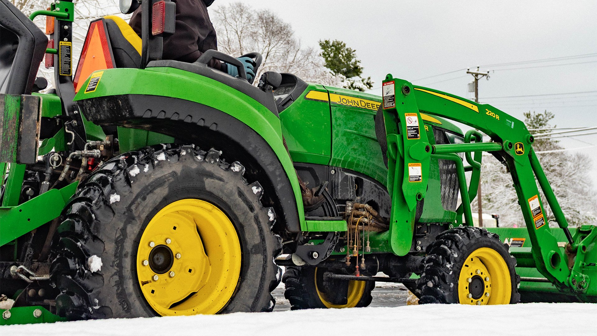 Plowing-snow-with-John-Deere-tractor-Koenig-Equipment