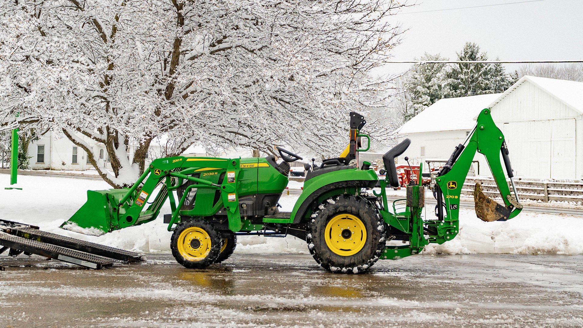 Service-for-tractor-plowing-snow-Koenig-Equipment