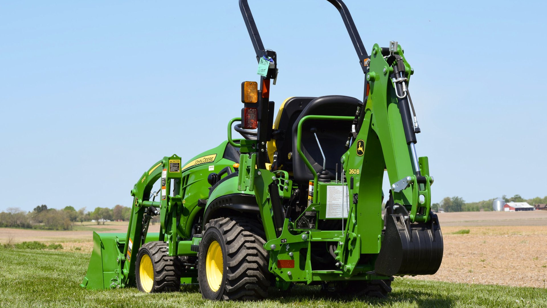 Small-John-Deere-for-Digging-Holes-with-Backhoe
