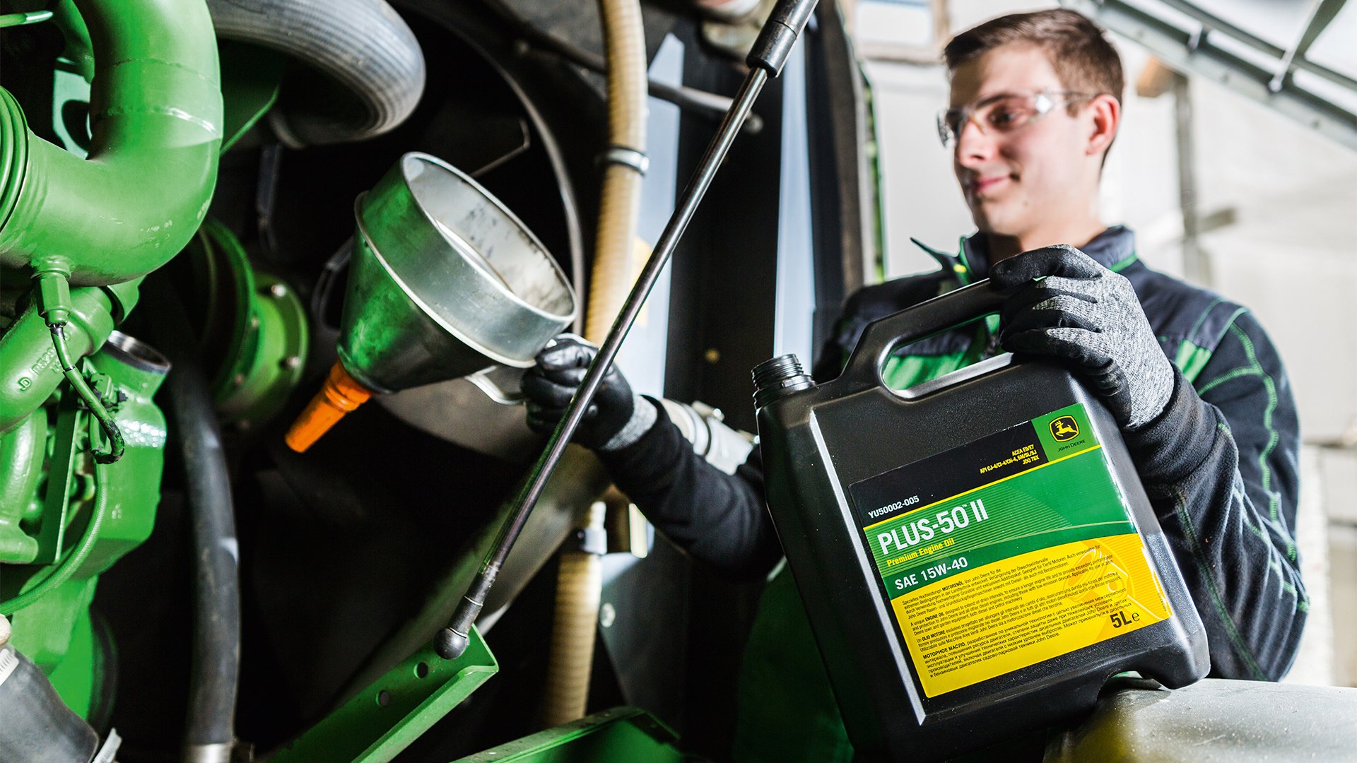 Technician-Checking-the-Engine-Oil-on-a-John-Deere