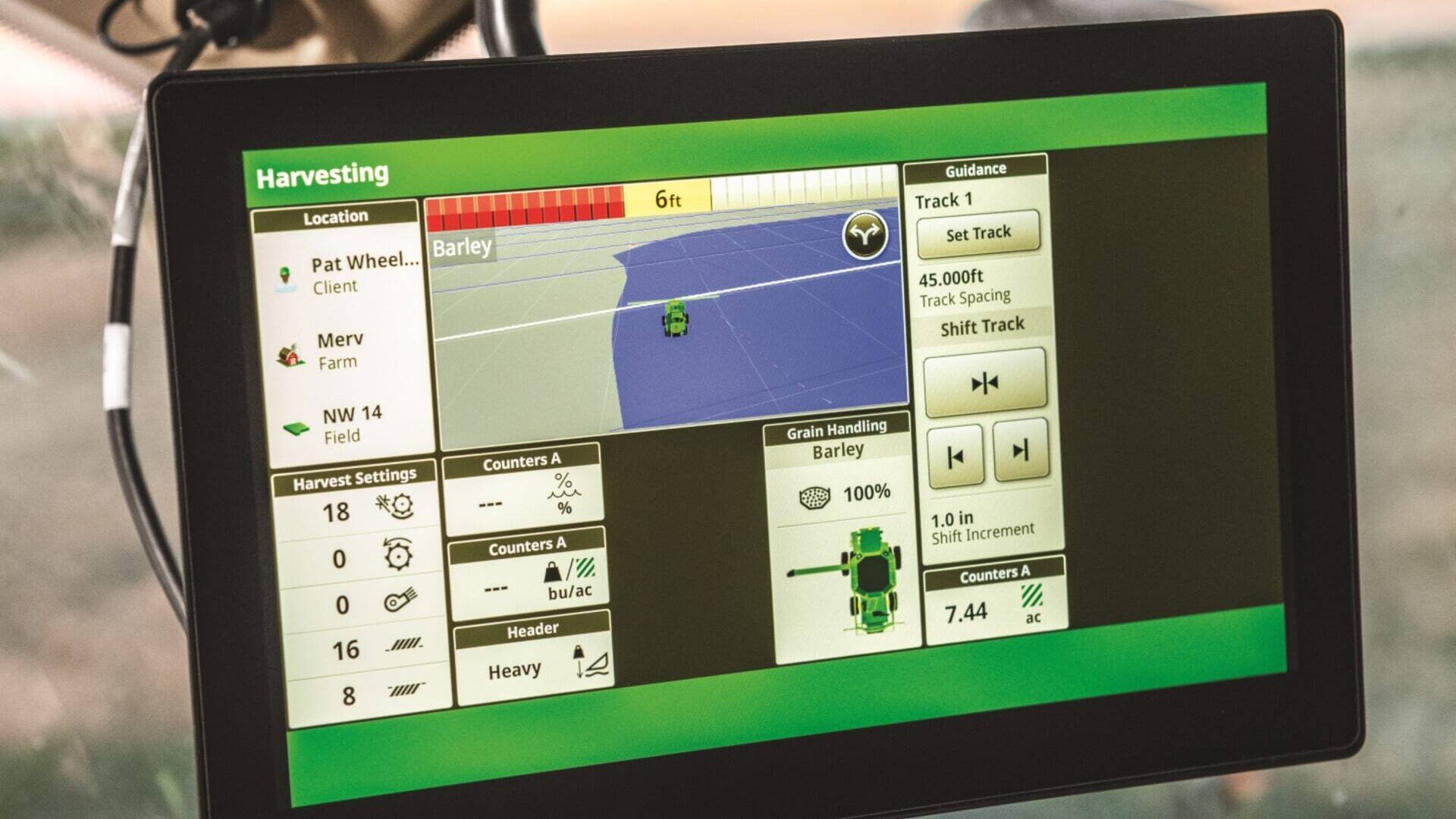 display of precision ag tracking a combine harvesting