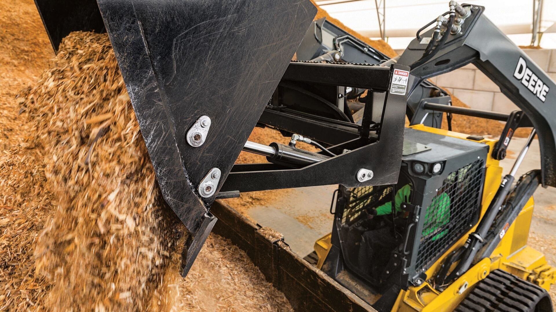 track loader dumping bedding